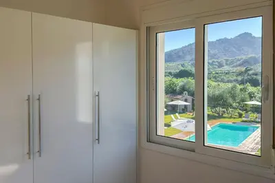 a room with a window with a view of a pool at Villa Adam in Chania Town
