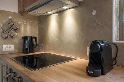 a kitchen with a coffee maker on a counter at Villa Eleftheria in Áyios Yeóryios