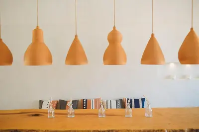 a group of lights hanging above a table at The Theodore Boutique Hotel- adults only 16 plus in Agia Marina Nea Kydonias