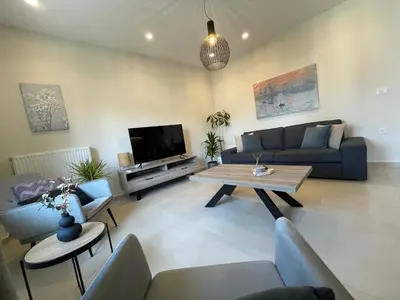 a living room with a couch and a table at Stefania's House in Chania Town