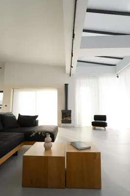 a living room with a couch and a coffee table at Hygge Villa Evgenia in Kounoupidhianá