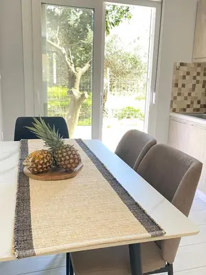 a dining room table with a pineapple on it at YVONNE's HOUSE in Chania Town