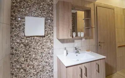 a bathroom with a sink and a mirror at Xirouchakis farm2 in Kissamos