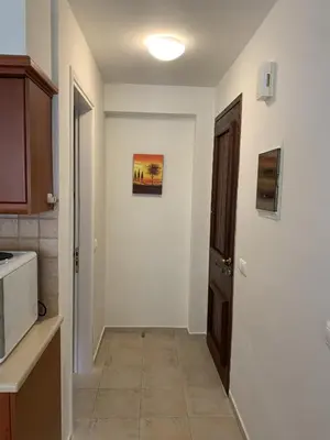 a kitchen with a hallway leading to a door at Villa Elias & Casseiopia in Chania Town
