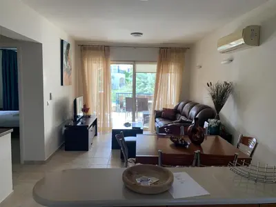 a living room with a couch and a table at Villa Elias & Casseiopia in Chania Town
