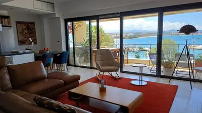a living room with a couch and a table at Ferienwohnung am Meer Belle Vue in Chania Town