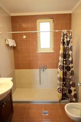 a bathroom with a shower and a sink at apartment irini in Vryses
