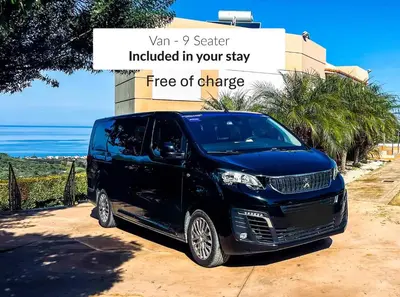 a black van parked in front of a building at Villa Ariella With Sea View in Agia Marina Nea Kydonias