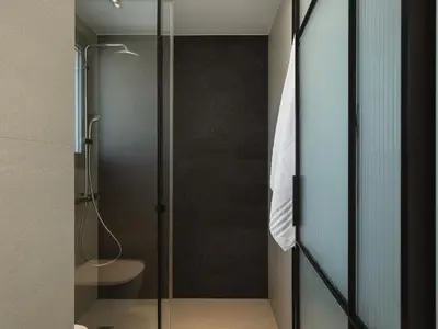 a glass shower stall with a toilet in a bathroom at Villa Iocaste - With private pool and EV station in Chania Town