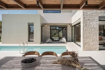 a villa with a swimming pool and a house at Villa Iocaste - With private pool and EV station in Chania Town