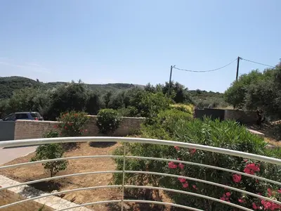 a view from a balcony of a garden with flowers at Villa Bellissima in Chania Town