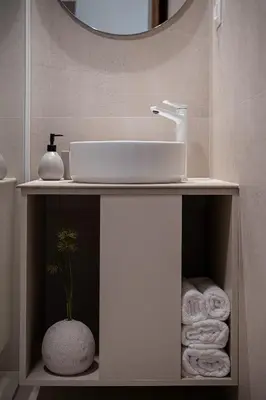 a bathroom vanity with a sink and a mirror at Aura Urban Living in the heart of Chania city in Chania Town