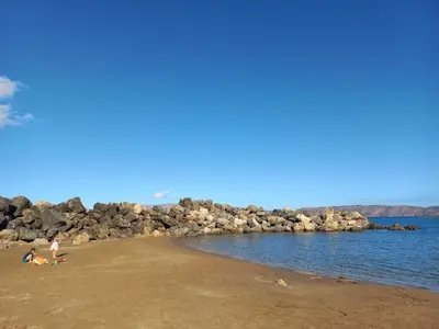 a group of people on a beach near the water at Zoe's Place - 1 BD Loft Beachfront Apartment in Kissamos