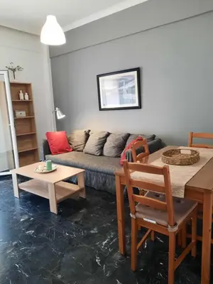 a living room with a couch and a table at Apartment Chania - Nea Chora in Chania Town