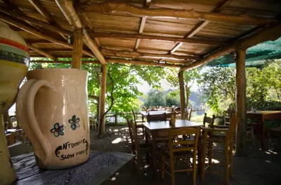 a large jug sitting on a table in a restaurant at House Of Ntounias ΙΙ in Dhrakóna