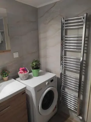 a washing machine in a bathroom with a sink at TziApartment in downtown Chania in Chania Town
