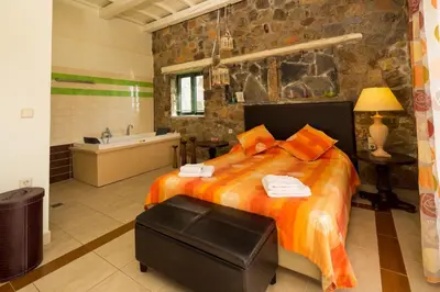 a bedroom with a large bed and a bath tub at Seaview villa Amphitriti with Private Pool, 20 min from Elafonissi beach in Chania Town