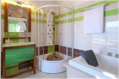 a bathroom with a tub and a toilet and a sink at Seaview villa Amphitriti with Private Pool, 20 min from Elafonissi beach in Chania Town