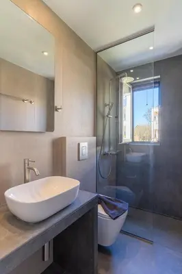 a bathroom with a sink and a toilet and a shower at Dreta Suites in Chania Town