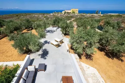 an overhead view of a plane parked in a field at Olisea Villa, olive grove seaview villa in Kounoupidhianá