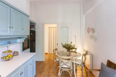 a kitchen with a table and chairs in a room at House of joy close to Chania center in Chania Town