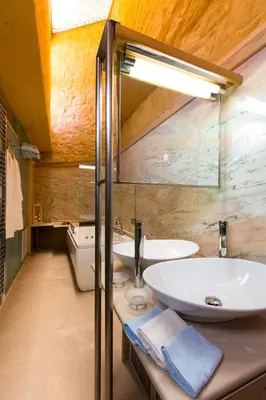 a bathroom with a sink and a mirror at Eleni's Serenity - Discovering Sapphire Harmonies in Ravdhoúkha