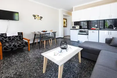 a living room with a couch and a table at Kaliopi's Apartments in Chania Town