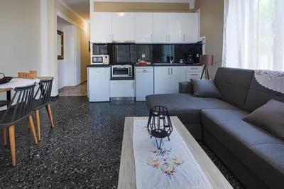 a living room with a couch and a table at Kaliopi's Apartments in Chania Town