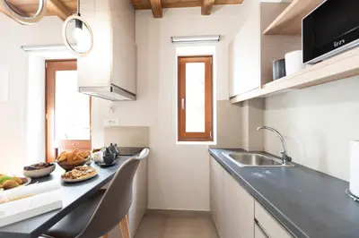 a kitchen with a counter top and a sink at Casa Di Sabbia in Chania Town