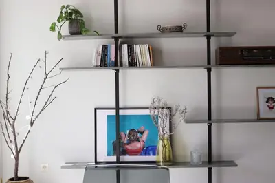 a book shelf with a picture on it at Upper Side Koum-Kapi in Chania Town