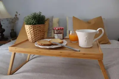 a coffee table with a plate of biscuits and a cup of coffee at Upper Side Koum-Kapi in Chania Town