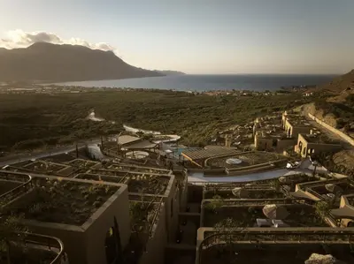 an aerial view of a city with the ocean at Tella Thera, a Member of Design Hotels in Kissamos