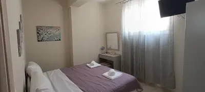 a hospital room with a bed and a mirror at Christos in Kissamos