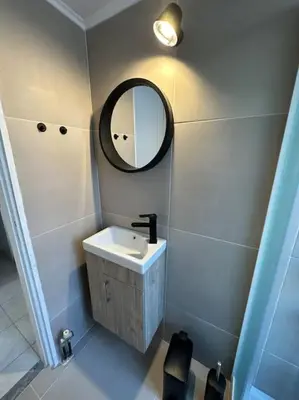 a bathroom with a sink and a mirror at Casa Di Sarpaki in Chania Town