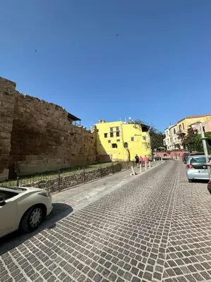 a white car parked on the side of a street at Casa Di Sarpaki in Chania Town
