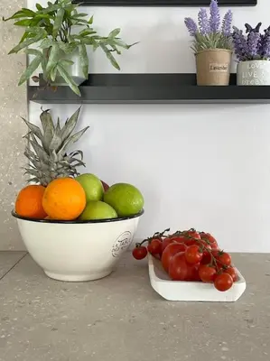 two bowls of fruit and vegetables on a counter at Ion villa - Xirokampi in Ayiá