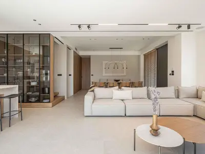 a living room with a white couch and a table at Sancy Luxury Villa I 400m beach, 