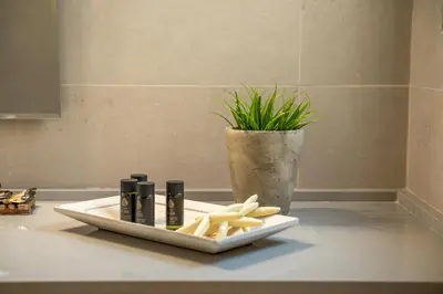 a plate of food on a counter in a bathroom at Koutris Apartment 1 in Falasarna