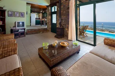 a living room with a view of the ocean at Amazing sea views at villa Elafonissi with private pool, near Elafonissi beach in Chania Town