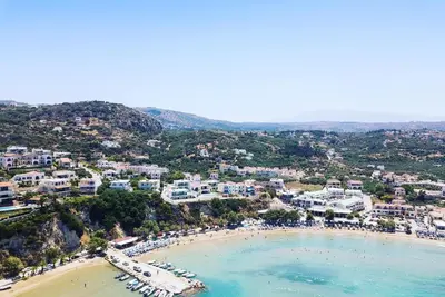 an aerial view of a beach in a town at Villa Annie Crete - Private Luxury Villa with Sea and Mountain Views in Tsivarás