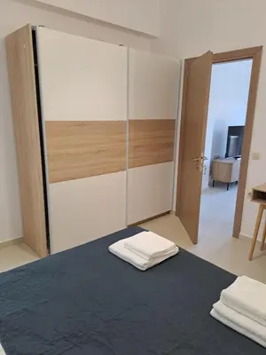 a room with a bed with a sliding door at Olea Homes in Plátanos