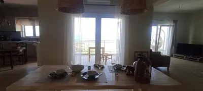 a living room with a table with dishes on it at Casa Lazareta in Chania Town
