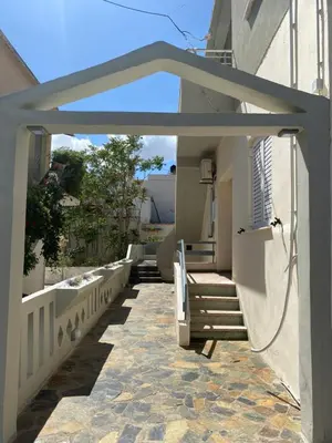 a patio with stairs leading to a house at Άγιος Ιωάννης in Chania Town