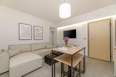a living room with a couch and a table at Penny's Apartment in Chania Town