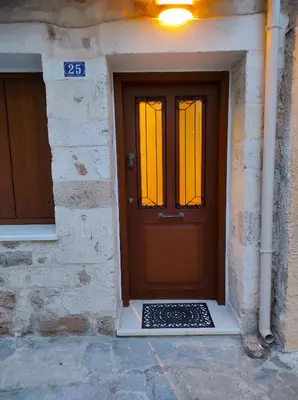 a door of a building with a sign on it at Ploumi in Chania Town