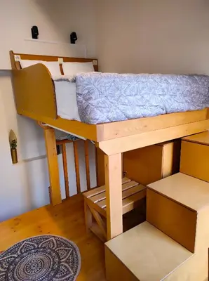 a bedroom with a bunk bed in a room at Ploumi in Chania Town