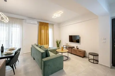 a living room with a couch and a table at Luxury Chic Retreat Suites in Chania Town