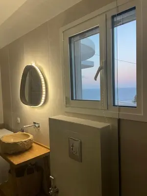 a bathroom with a sink and a window at Moments in Áptera