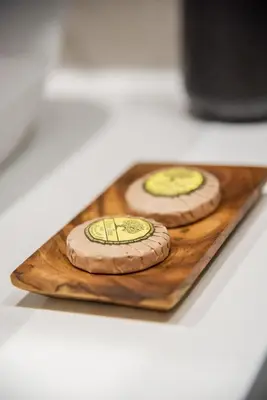 two pizzas sitting on a wooden cutting board at Boho Chic Retreat Suite in Chania Town