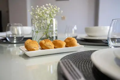 a plate of rolls sitting on a table at Natalia's Apartment in Tavronitis in Tavronitis
